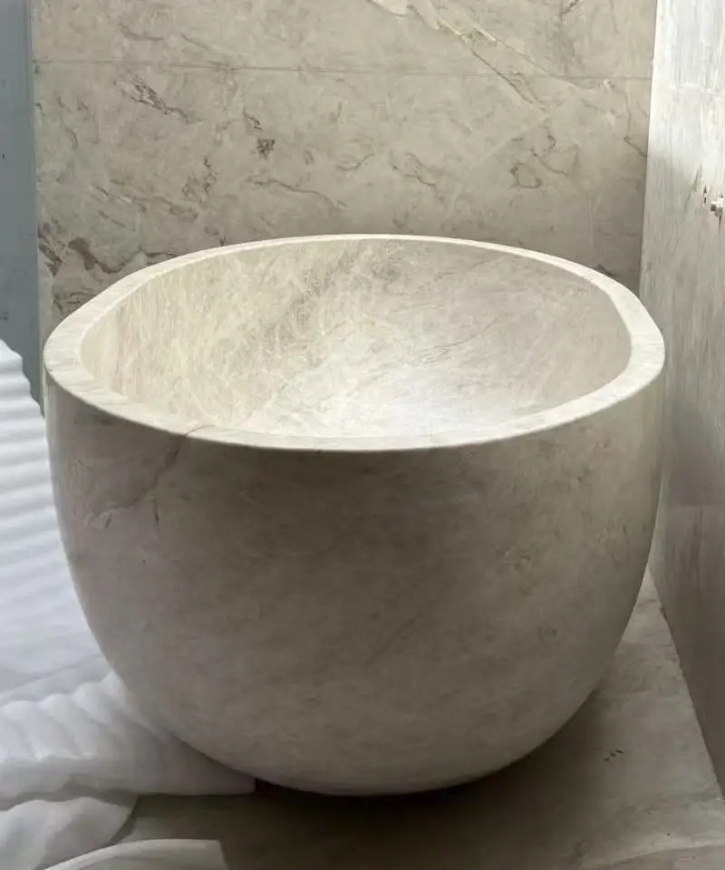 custom Taj Mahal quartzite bathtub installed in luxury bathroom project