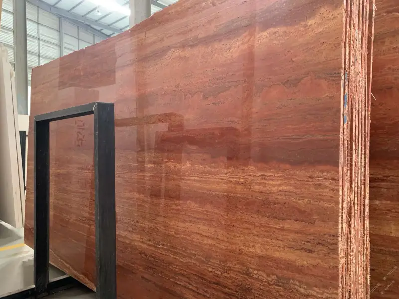 Red Travertine vein-cut slabs with layered red and rust tones