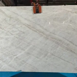 Taj Mahal quartzite slab with elegant diagonal grey veining.